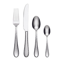 Set of silver cutlery with textured handles on a white background