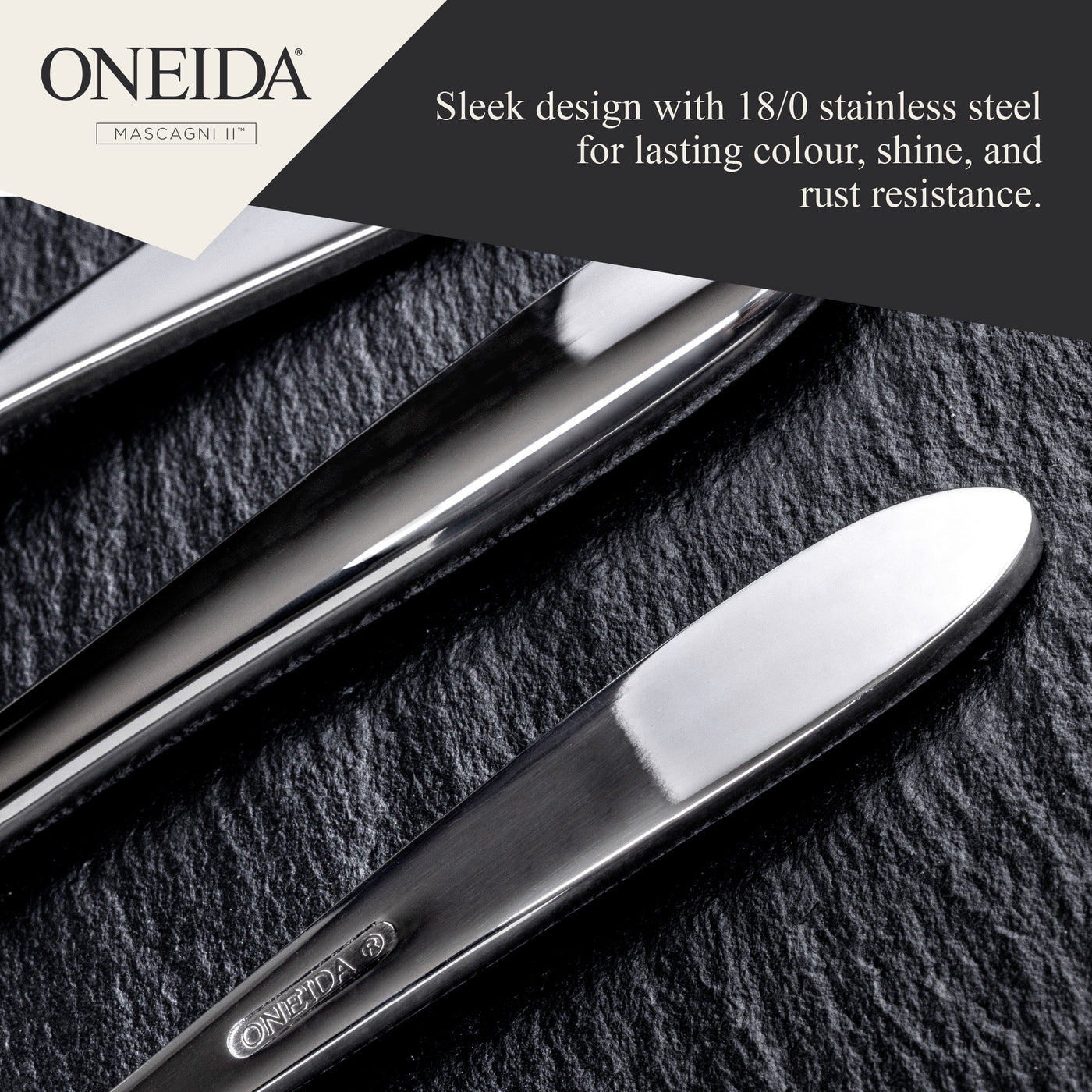 Two silver cutlery items on a dark surface with Oneida branding and text about stainless steel quality.